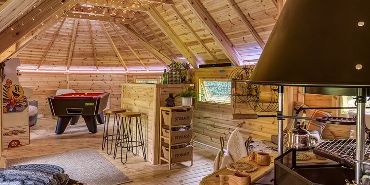inside a large log cabin bar