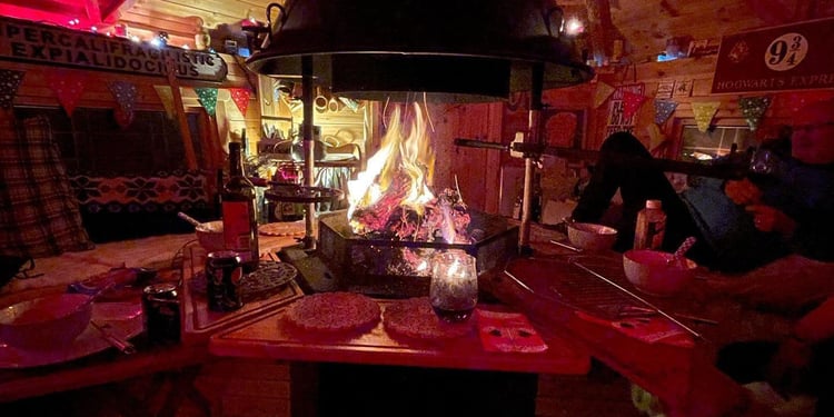 Interior of a BBQ cabin with fire lit