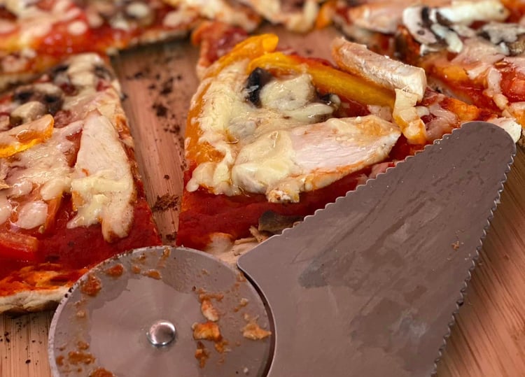 Close up of pizza cooked in a BBQ Grill Top Pizza Oven