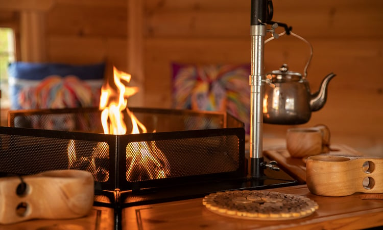 BBQ Grill Cabin with fire burning and kettle