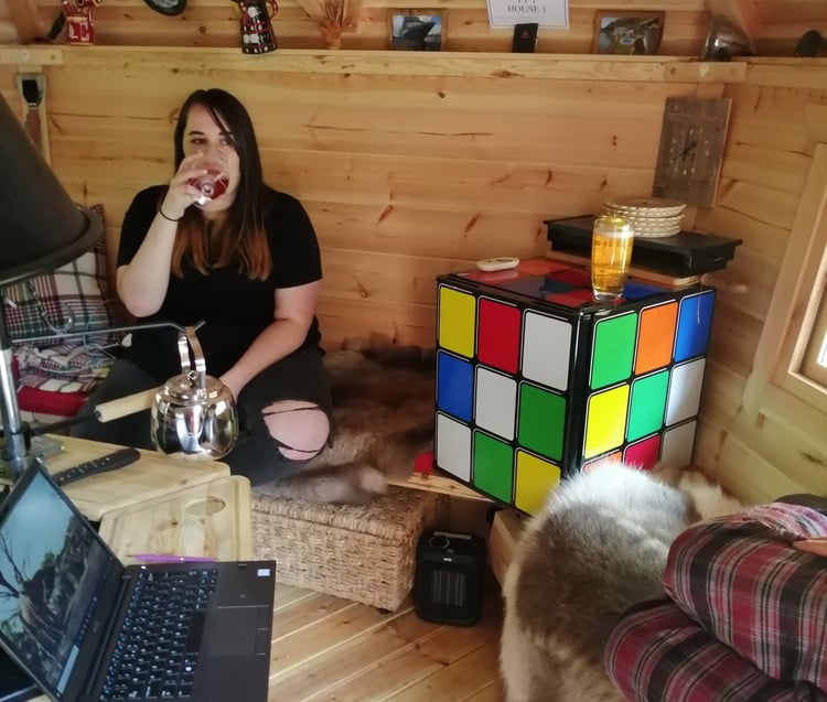 Arctic Cabins Garden Room Teen Den with teenager and giant Rubix cube