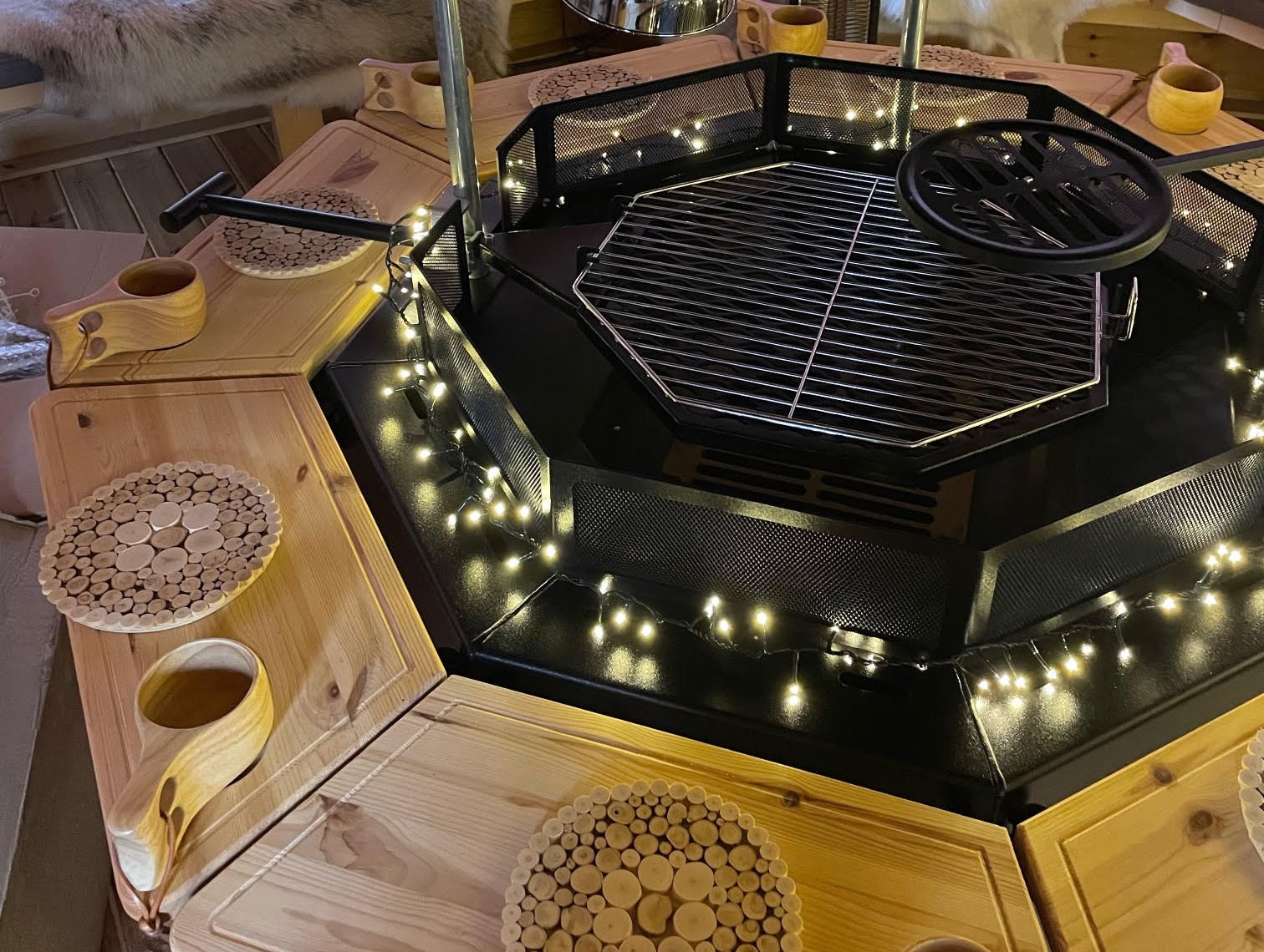 Arctic Cabins BBQ hut with fairy lights twinkling around grill unit