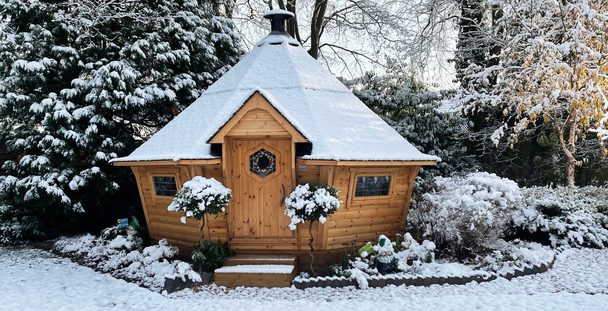 Snow covered Arctic Cabin Scandi BBQ hut