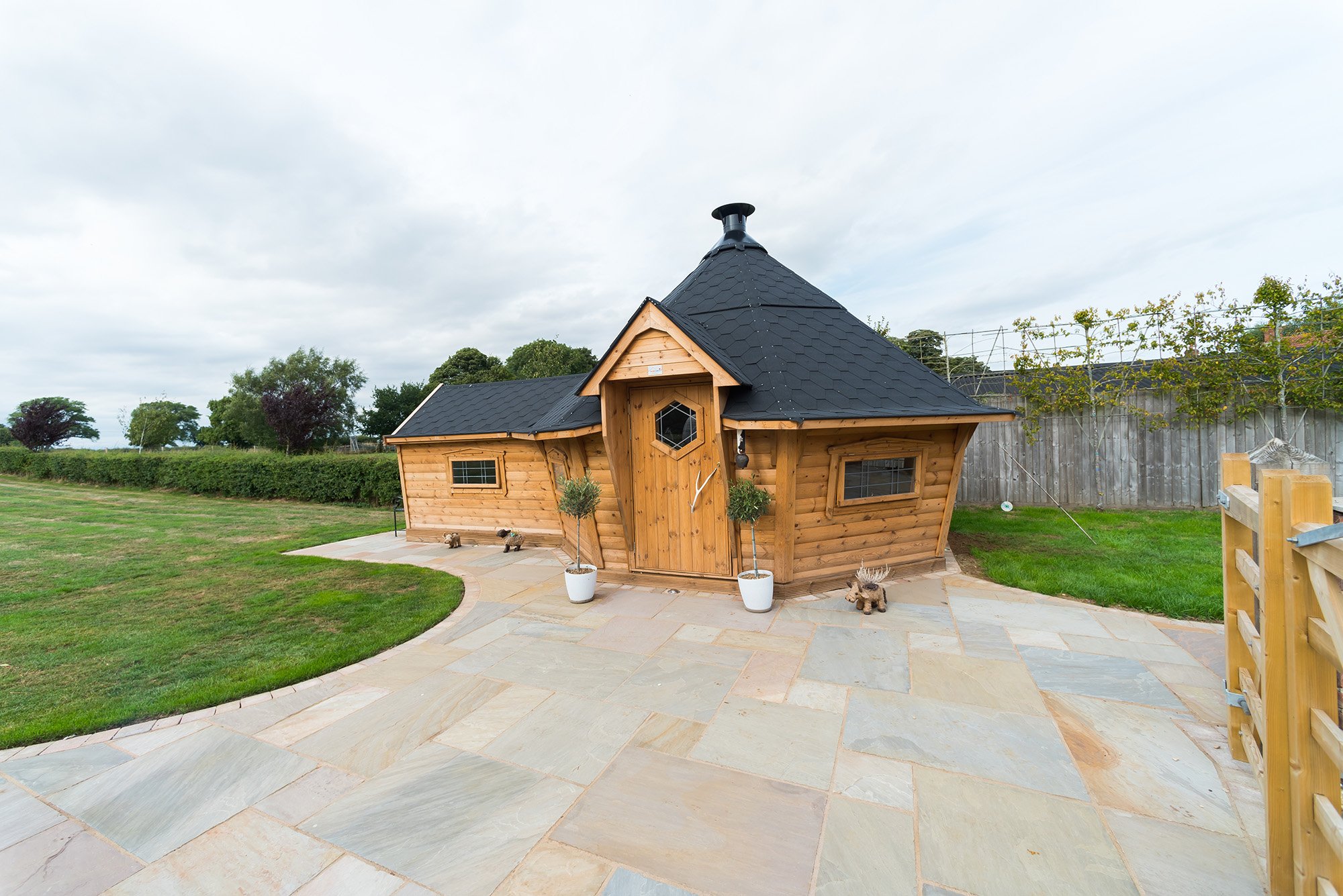 Exterior of Arctic Cabin extended BBQ House within country garden