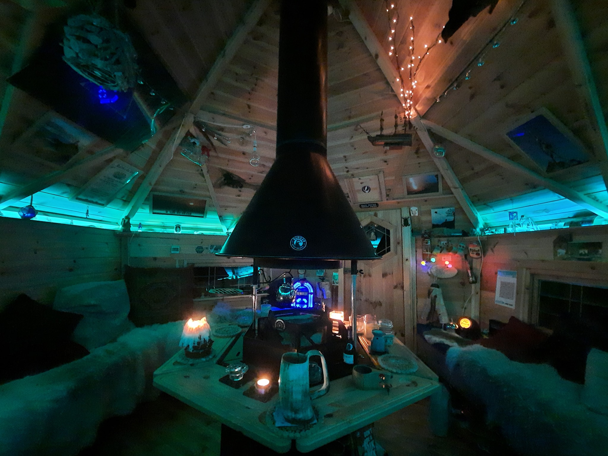 Interior at nighttime, of Arctic Cabins BBQ Cabin