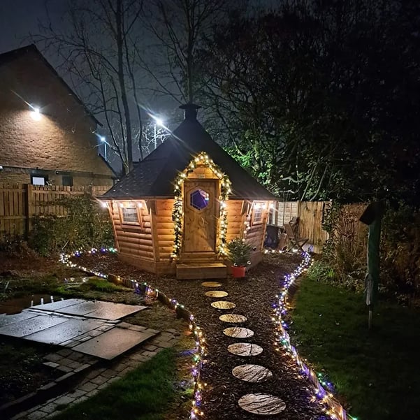 10m2 BBQ Cabin light up with fairy lights at night