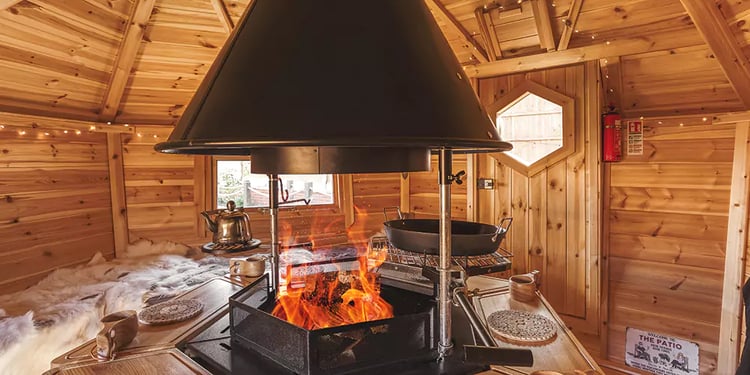 inside an arctic cabin with fire lit