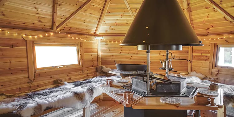 interior of an arctic cabin with fairy lights