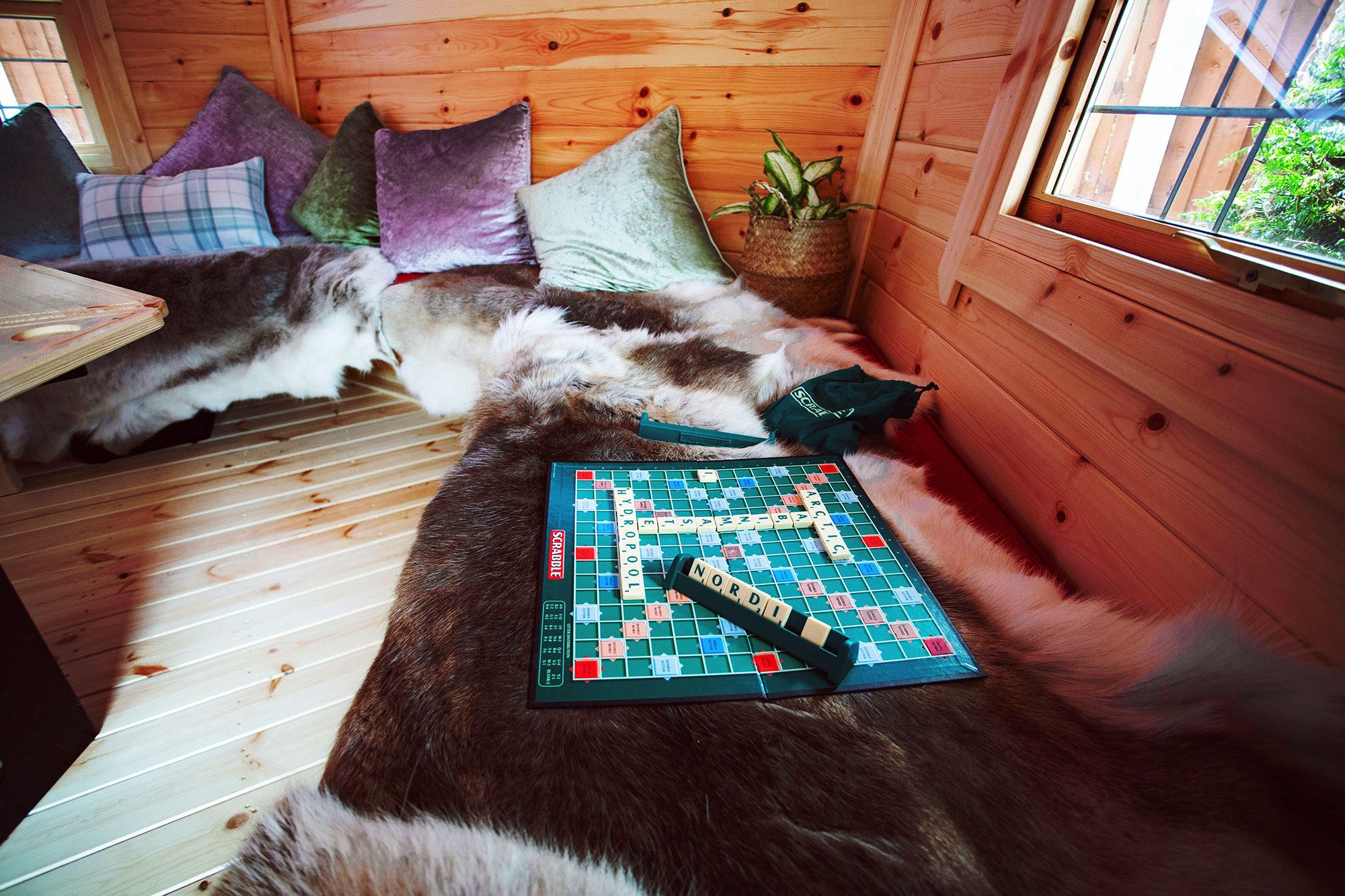 Inside Arctic Cabins BBQ Hut with Scrabble board
