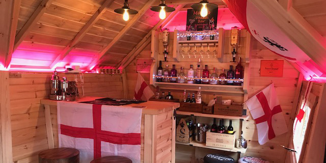 Internal shot of a BBQ hut garden bar man cave decorated with St George's Day accessories