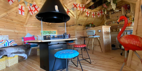 Interior of a BBQ log cabin bar decorated for the coronation